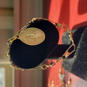 Gold Tone Fishing Hardware Bracelet with Religous Medal